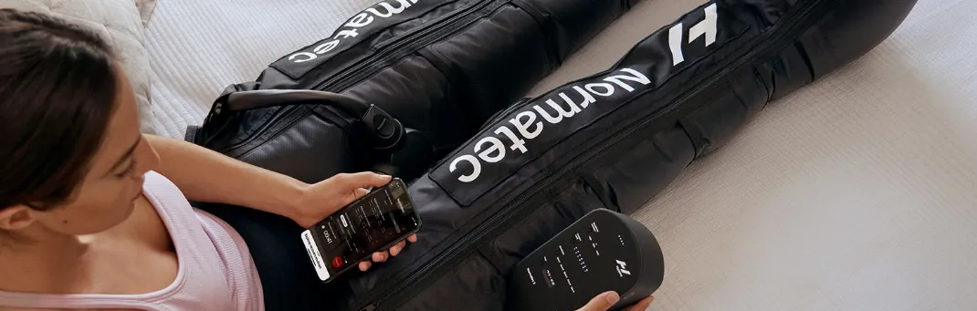 Normatech compression therapy for pain relief. Patient using device for faster muscle recovery at rehabilitation clinic