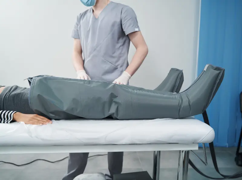 Normatec compression therapy for work injury rehab. Pain relief and mobility recovery at our physical therapy clinic.