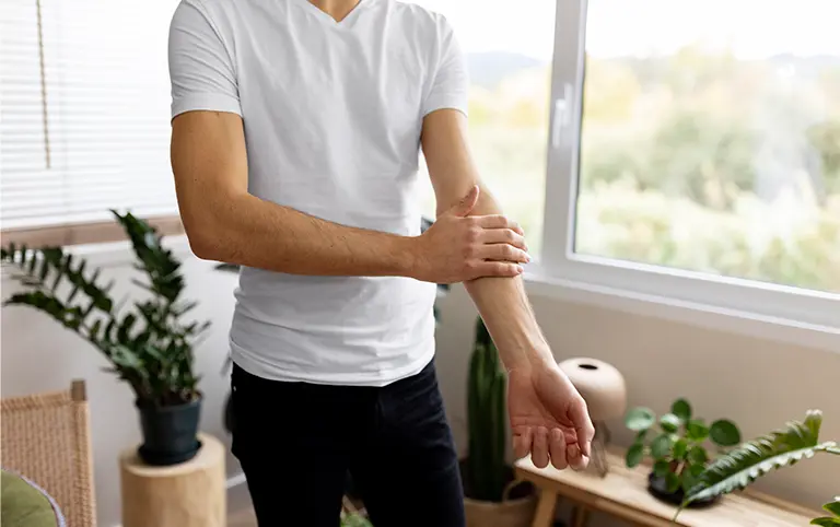 Hand wrist pain treatment at rehabilitation clinic. Physical therapy for work injury rehab. Pain relief and mobility recovery.