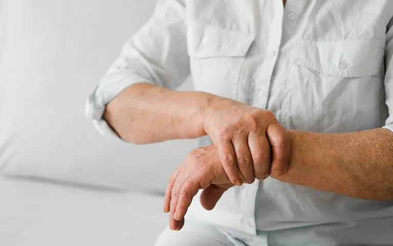 Hand wrist pain treatment: Rehab clinic patient seeks pain relief and mobility recovery after work injury. Physical therapy improves function.
