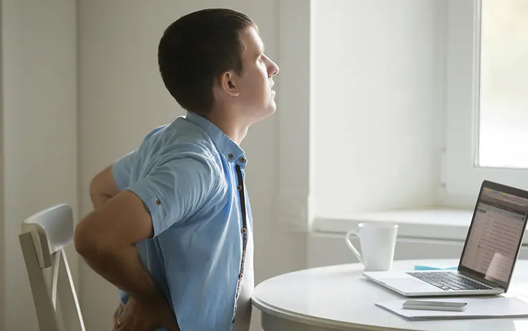 Hip pain therapy. Back pain relief at rehabilitation clinic. Improve mobility with physical therapy for work injury recovery.