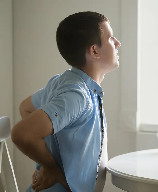 Hip pain therapy. Back pain relief at rehabilitation clinic. Improve mobility with physical therapy for work injury recovery.