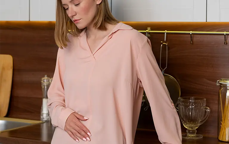 Pelvic floor pain therapy. Woman holding abdomen. Pain relief, mobility recovery at rehabilitation clinic.