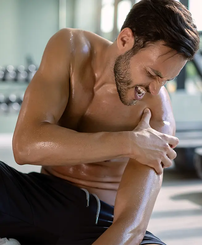 Shoulder pain: Patient seeking physical therapy for work injury rehab. Pain relief, mobility recovery at rehabilitation clinic