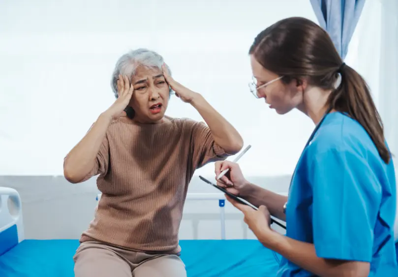 Work injury rehab: Therapist assists patient during functional capacity evaluation. Pain relief & mobility recovery at our clinic.