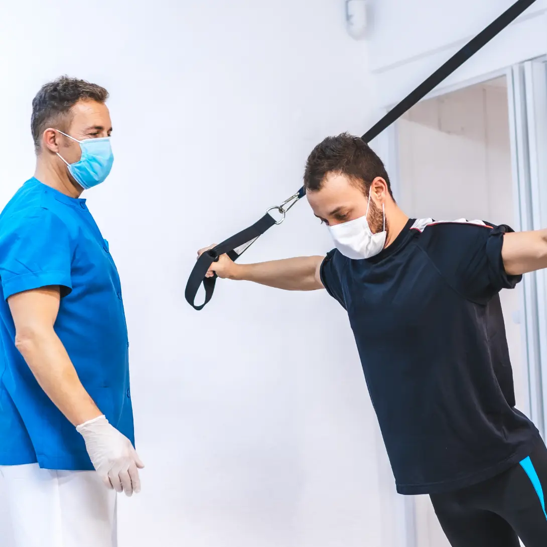 Work injury rehab: Therapist assists patient with mobility. Personalized physical therapy for pain relief and faster recovery.